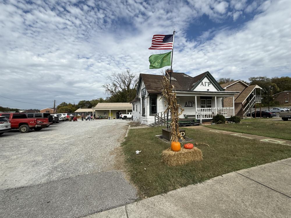 The Beta Mu Chapter House standing with the Activities Center in the background.