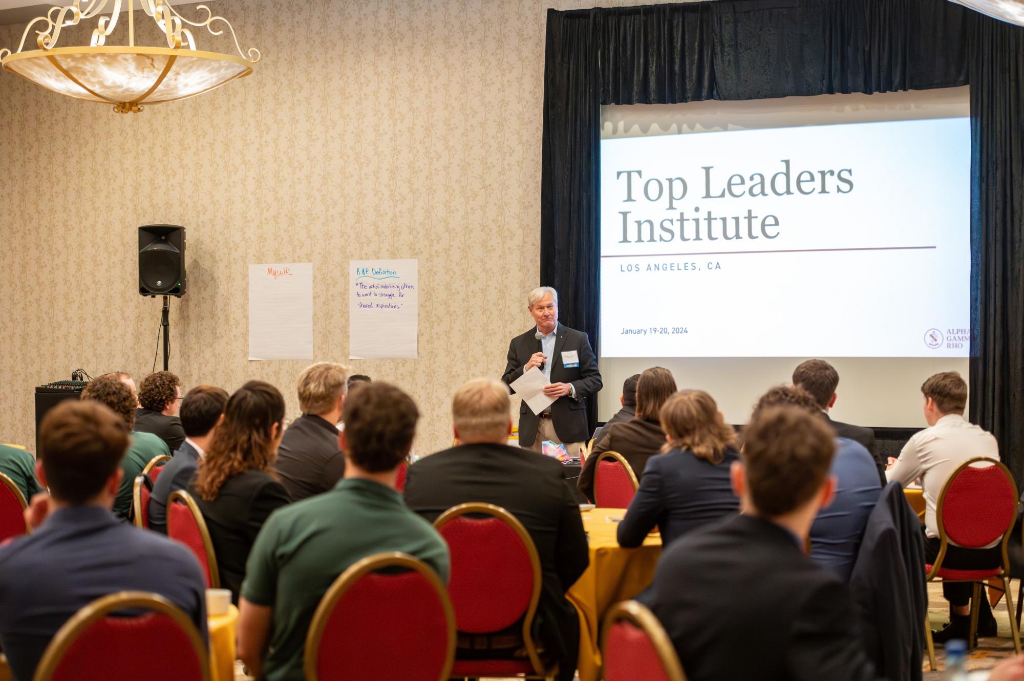 Glen Stith speaks to members of Alpha Gamma Rho Fraternity at the Top Leaders Institutes.